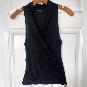 Bebe sleeveless wrap top size XS in black